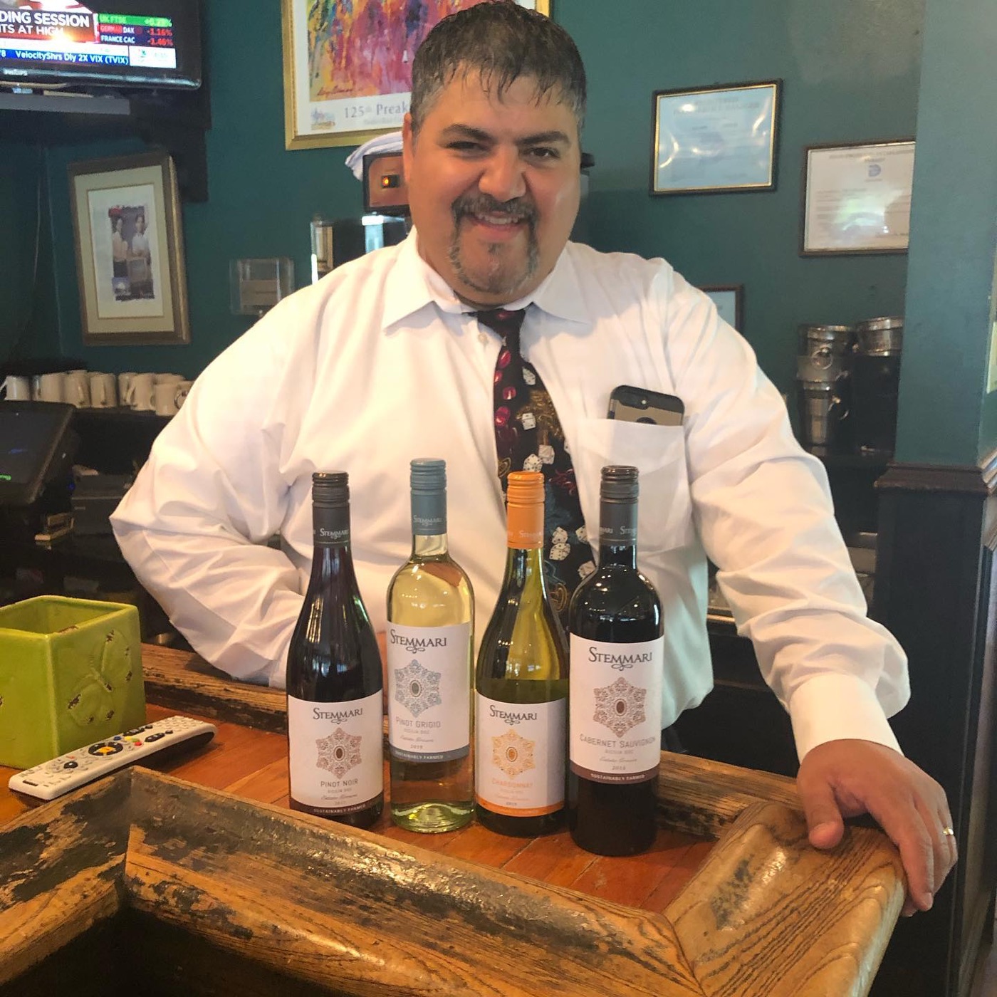 Our bartender with the wine of the month