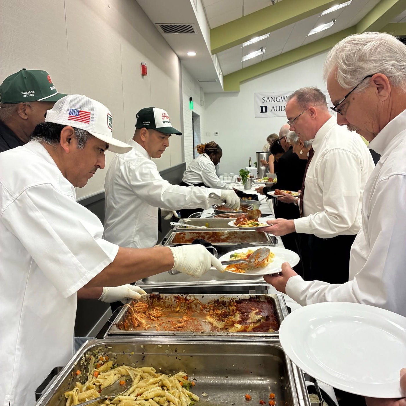 Prego staff serving a buffet line