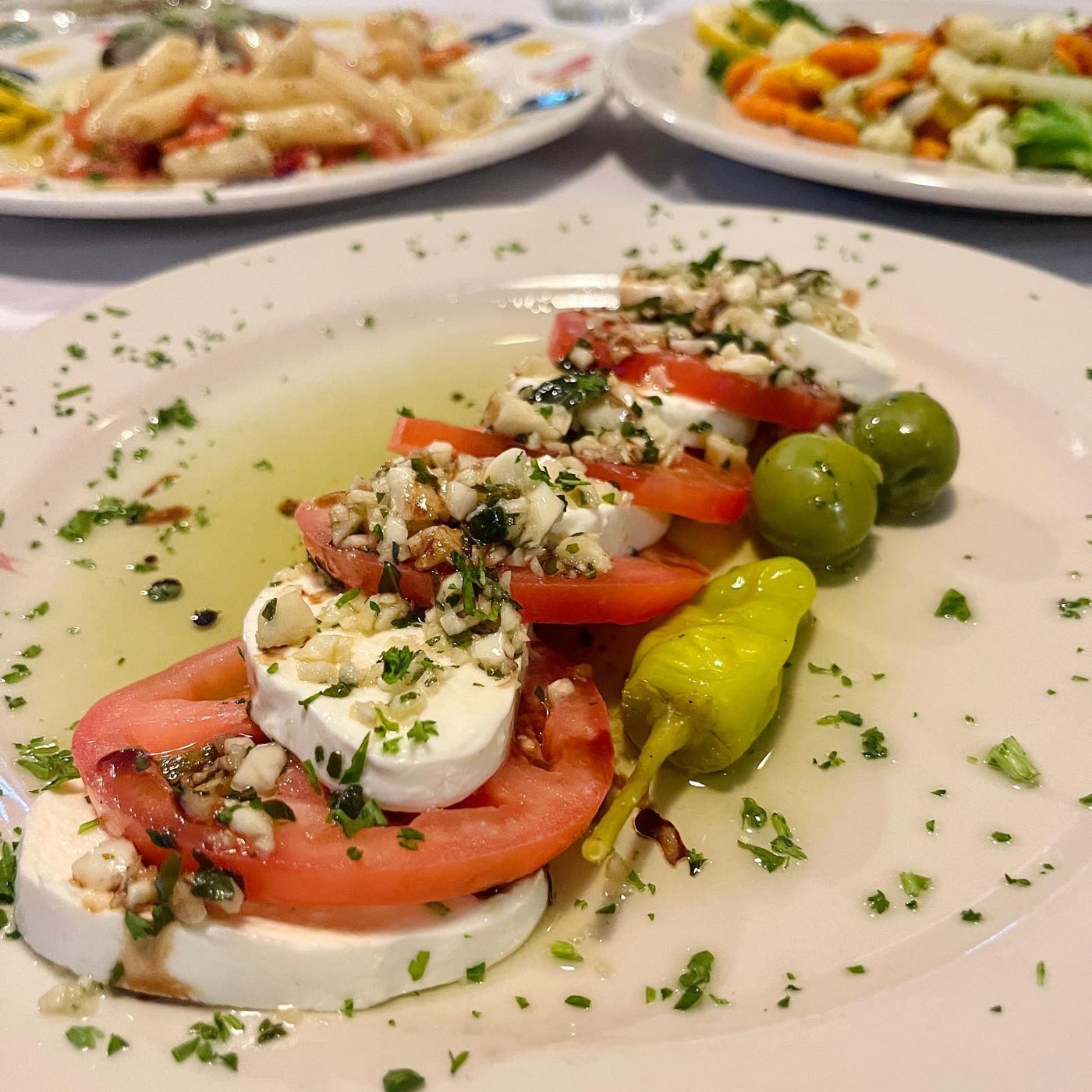 Sliced tomatoes, fresh mozzarella and basil